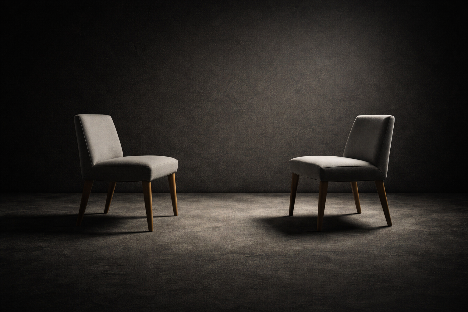 Two empty chairs facing each other with space between them, symbolizing dialogue, boundaries, and encounter in relationships.